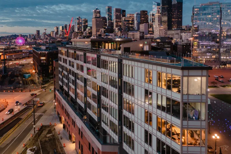 Gridiron building exterior at night